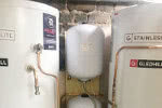 Unvented hot water cylinders replacing old open vented cylinders with a secondary return.