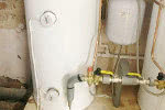 Unvented hot water cylinders replacing old open vented cylinders with a secondary return.